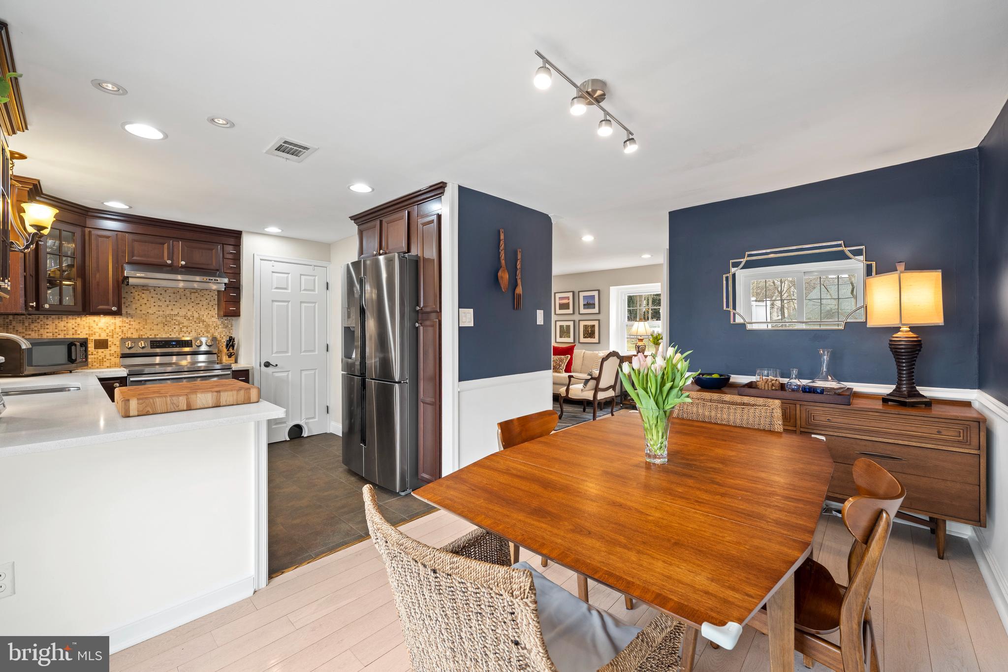 412 Iven Avenue Wayne, PA 19087 - Photo 11 of 26 a large kitchen with sink a refrigerator and chairs