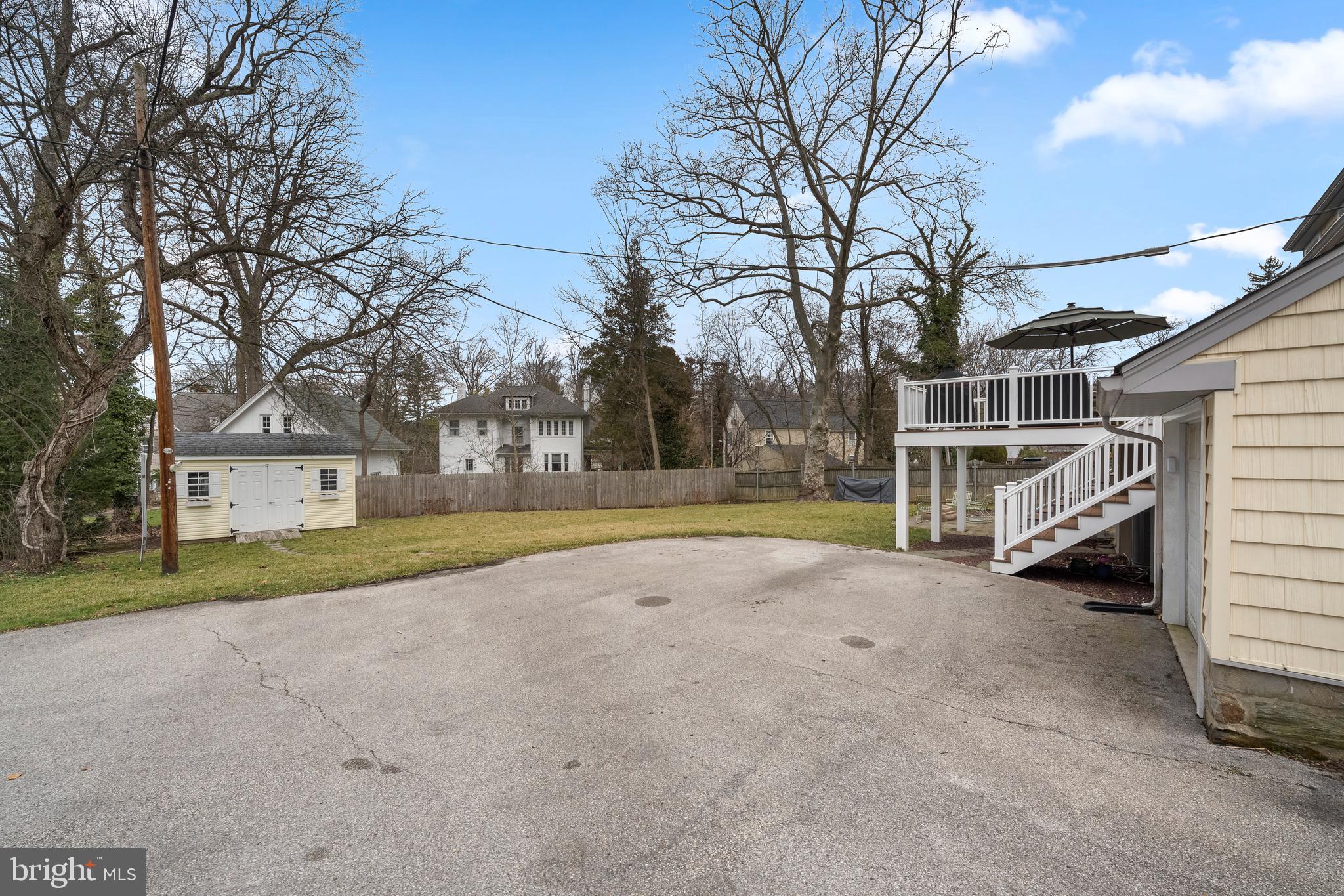 412 Iven Avenue Wayne, PA 19087 - Photo 25 of 26 a view of a house with a large tree and a yard
