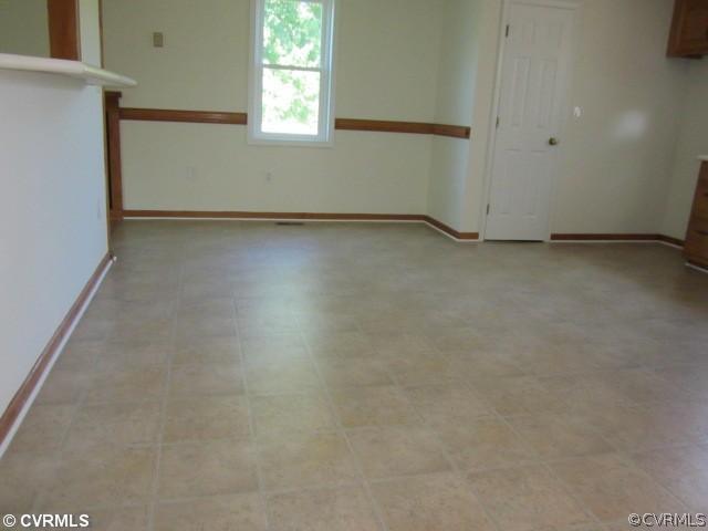 7312 Woodpecker Road Chesterfield, VA 23838 - Photo 3 of 9 an empty room with windows