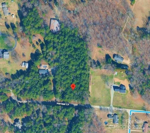 an aerial view of house with yard