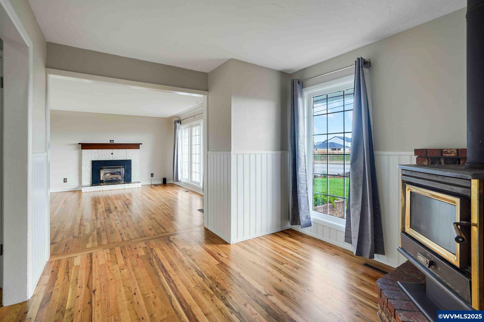 4843 Hazelgreen Road Northeast Salem, OR 97305 - Photo 42 of 48 a bedroom with a bed and a fireplace