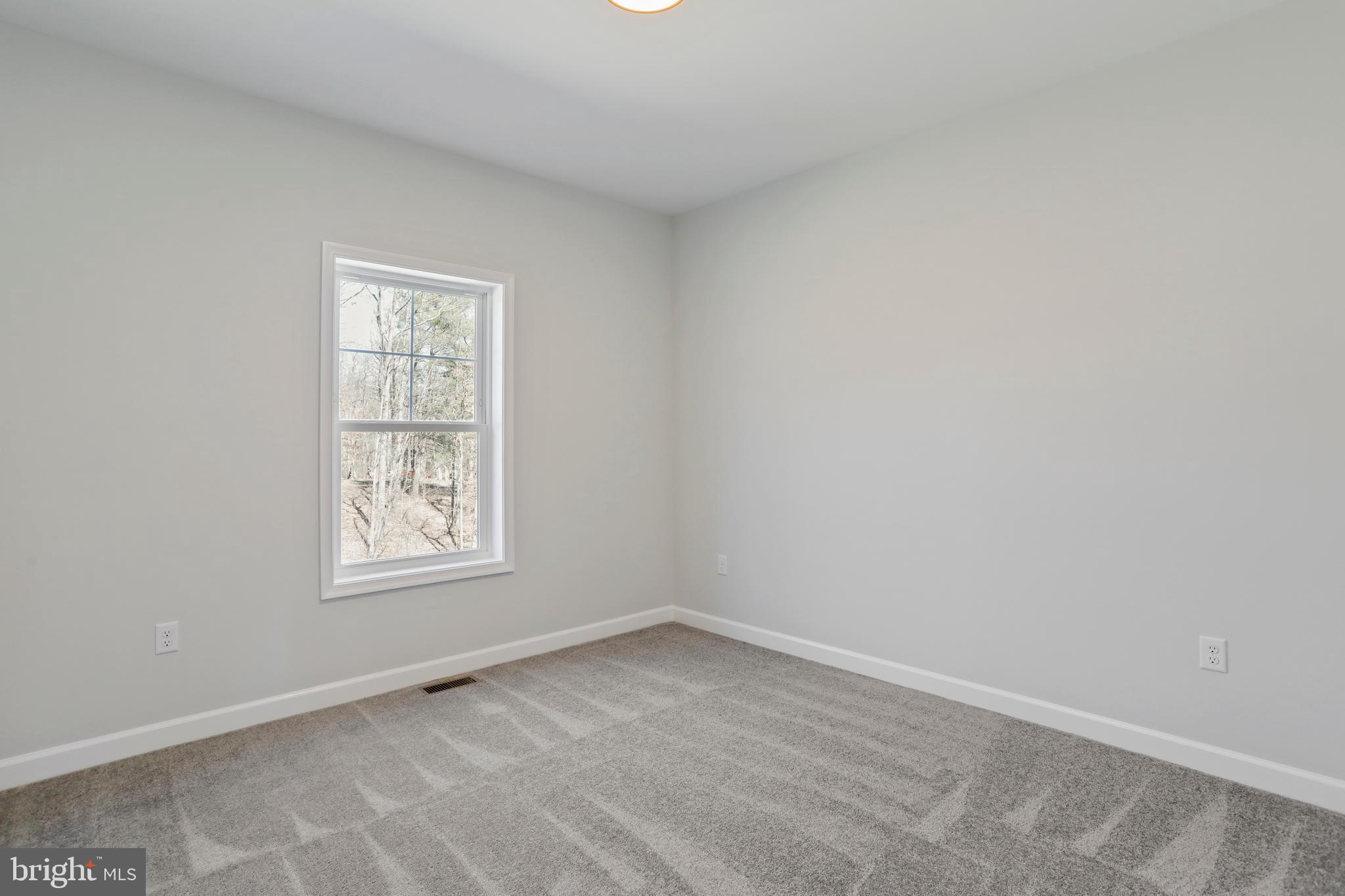 32 Larimar Lane Inwood, WV 25428 - Photo 25 of 28 an empty room with a window