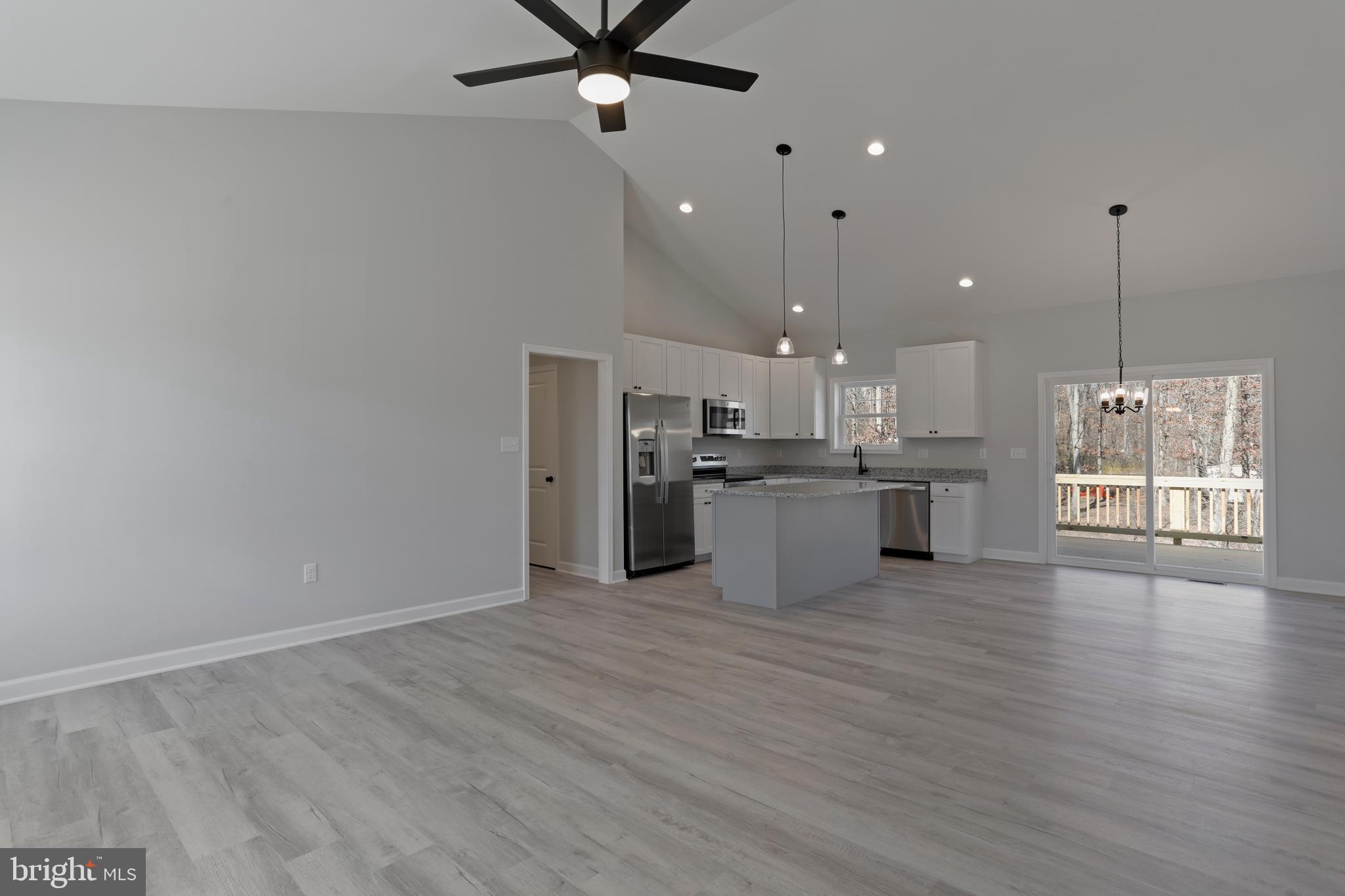 32 Larimar Lane Inwood, WV 25428 - Photo 3 of 28 a view of a kitchen with a stove cabinets and wooden floor