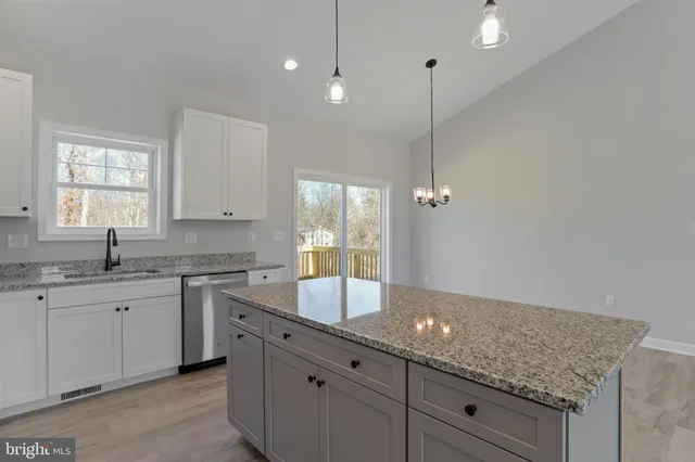 a kitchen with sink and window