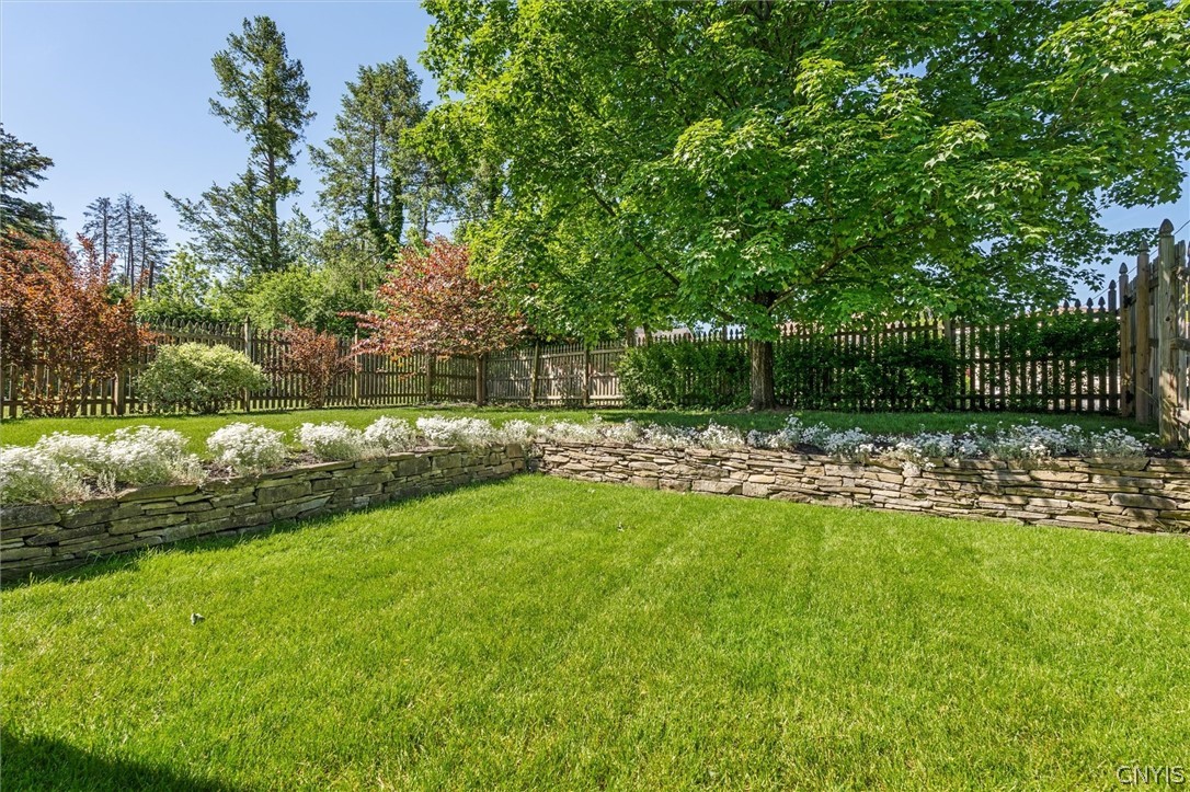 108 Shirley Road Syracuse, NY 13224 - Photo 40 of 50 Fully Fenced yard with flower beds