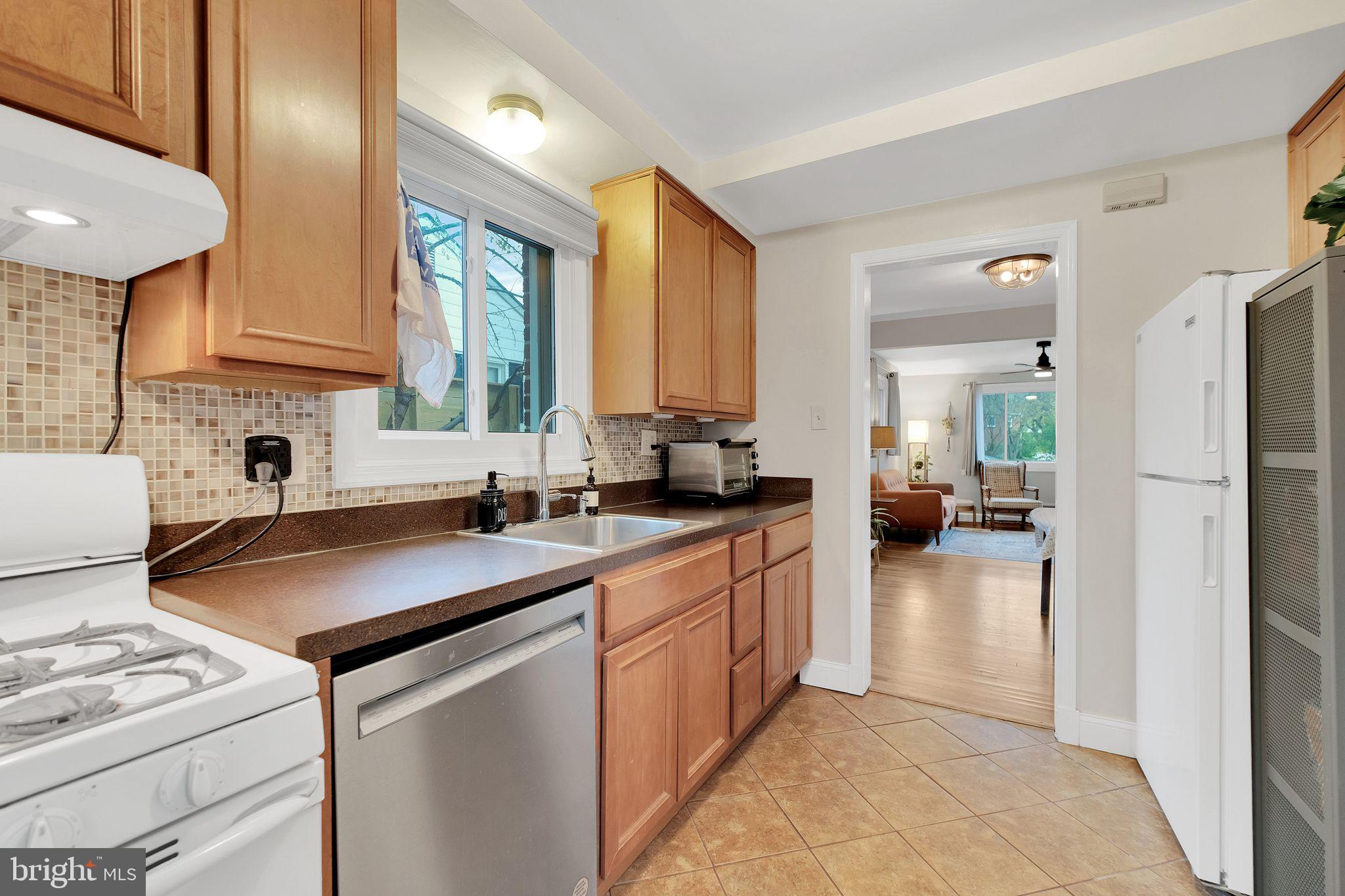 2204 Prichard Road Silver Spring, MD 20902 - Photo 11 of 26 a kitchen that has a sink and a stove in it
