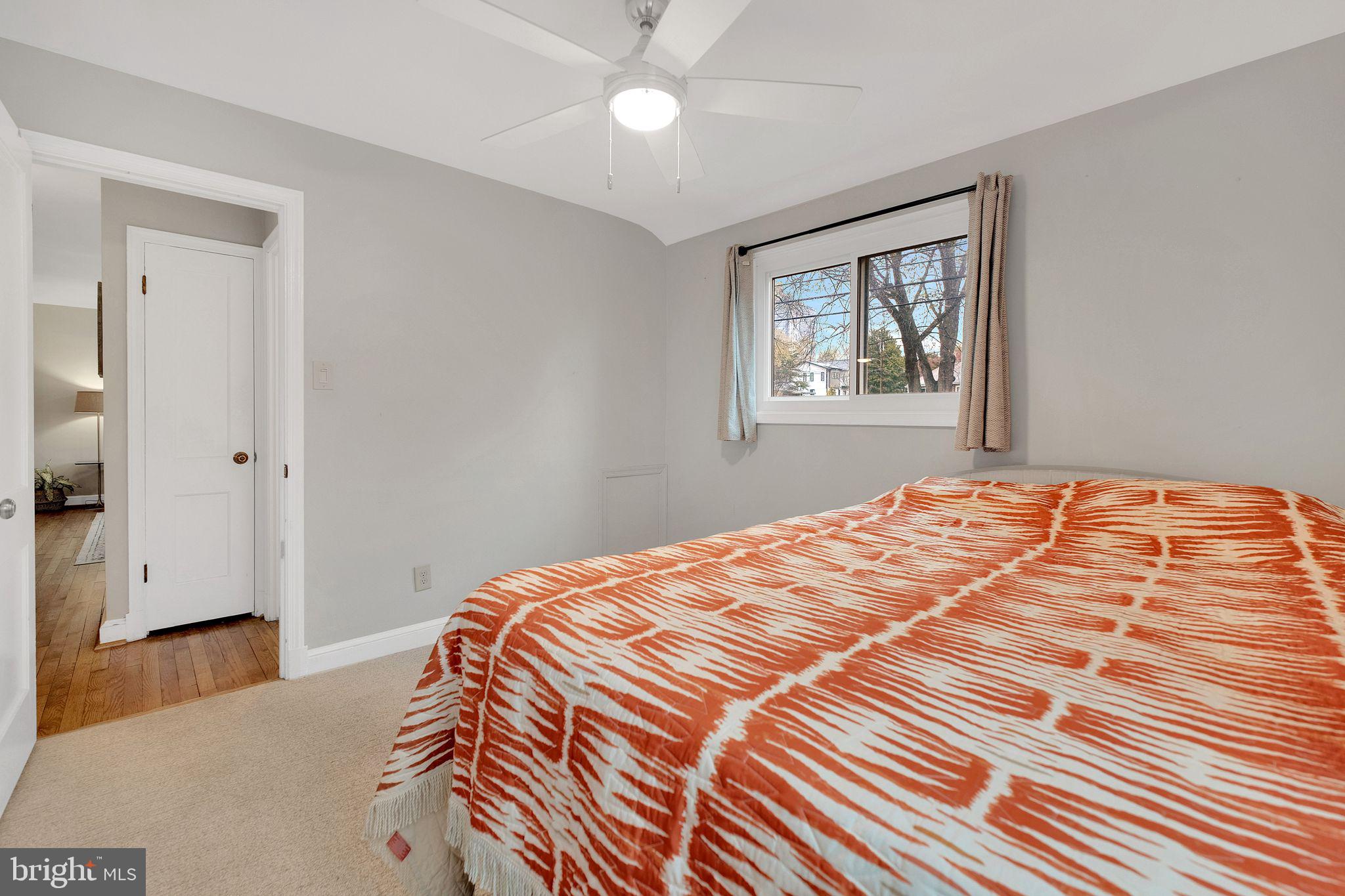 2204 Prichard Road Silver Spring, MD 20902 - Photo 15 of 26 a bedroom with a bed and a painting on the wall