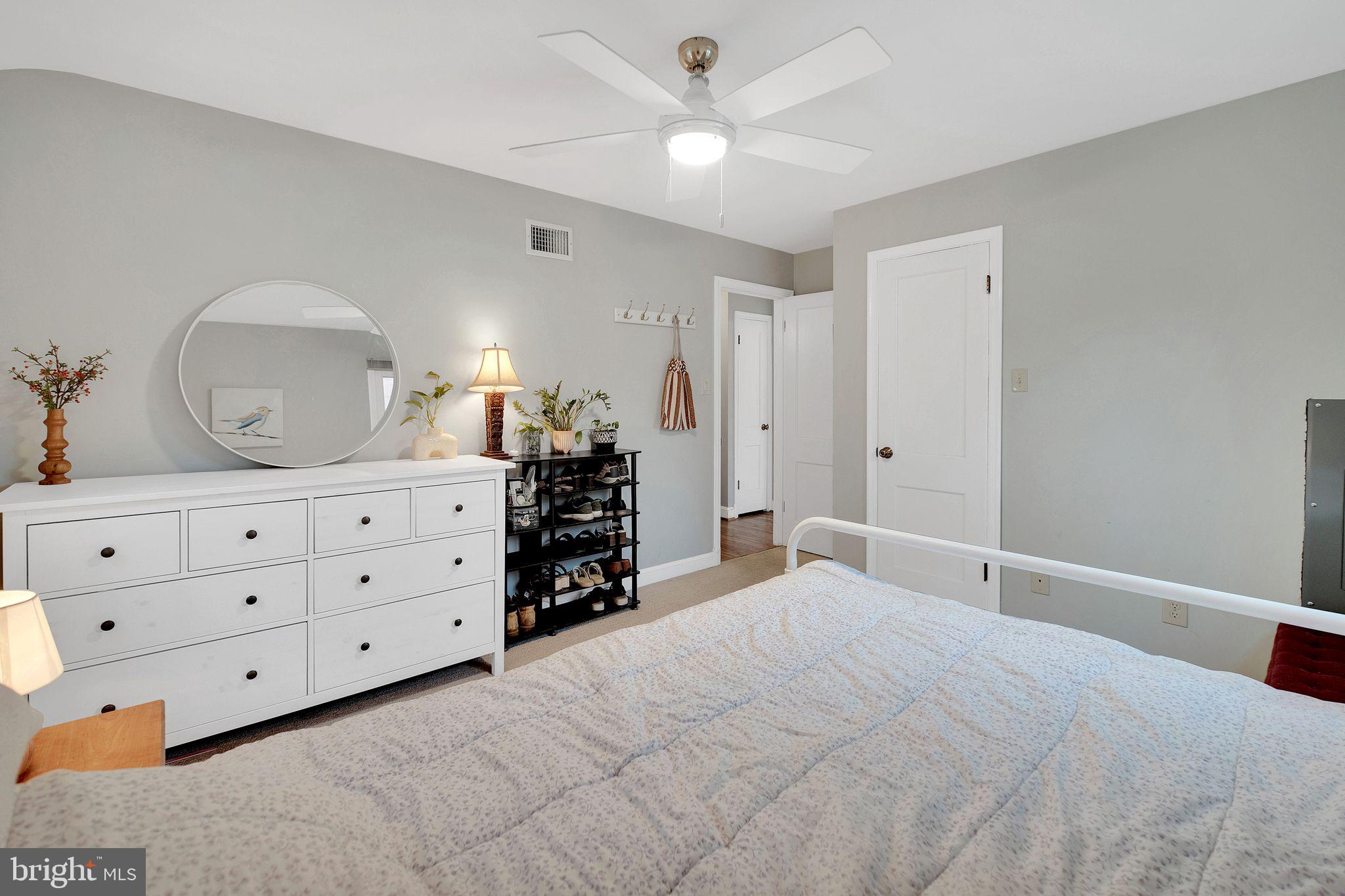 2204 Prichard Road Silver Spring, MD 20902 - Photo 16 of 26 a bedroom with a bed and a dresser