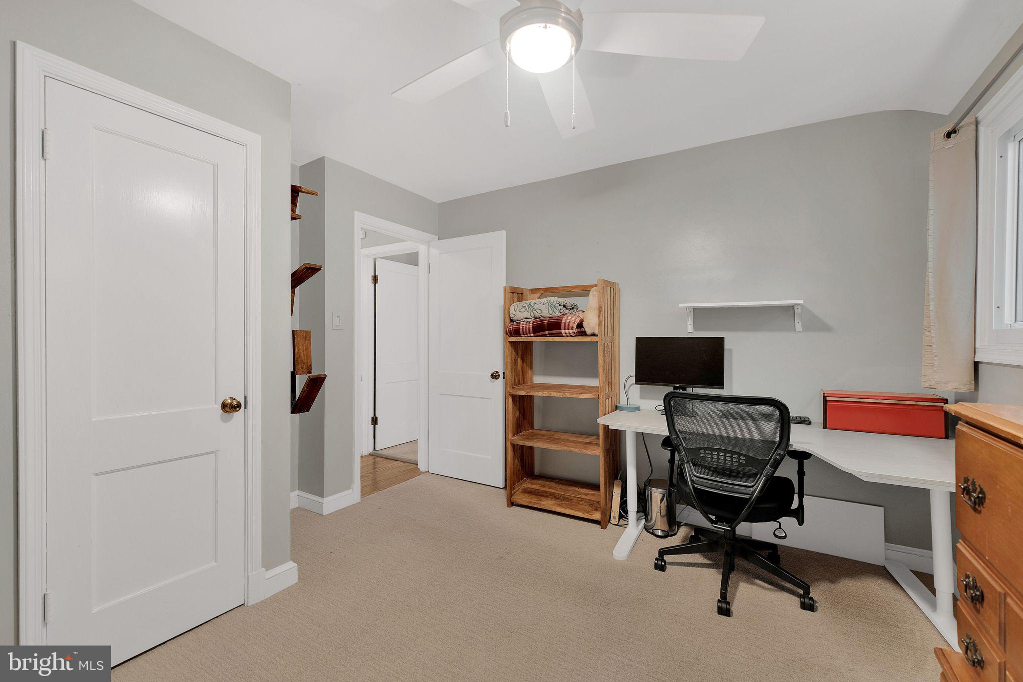 2204 Prichard Road Silver Spring, MD 20902 - Photo 19 of 26 a view of a workspace with furniture and a window
