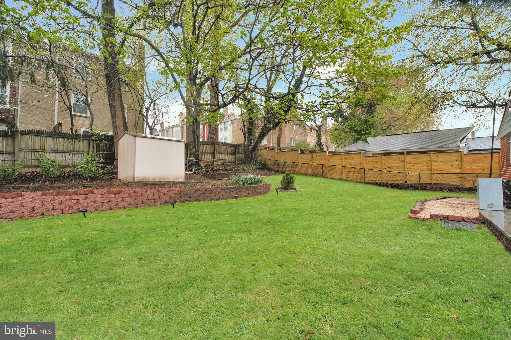 2204 Prichard Road Silver Spring, MD 20902 - Photo 24 of 26 a view of a backyard with large trees