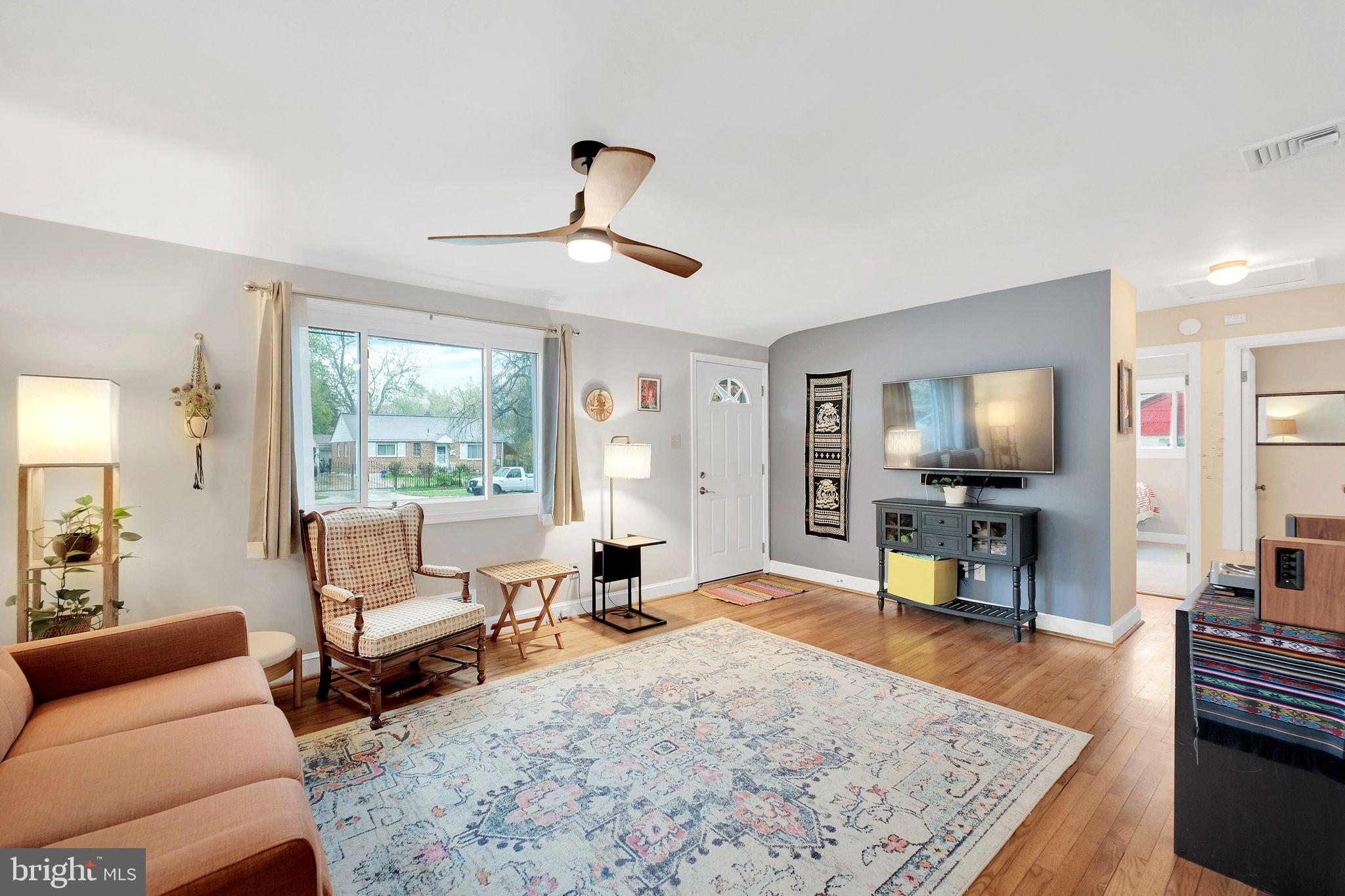 2204 Prichard Road Silver Spring, MD 20902 - Photo 5 of 26 a living room with furniture and a flat screen tv