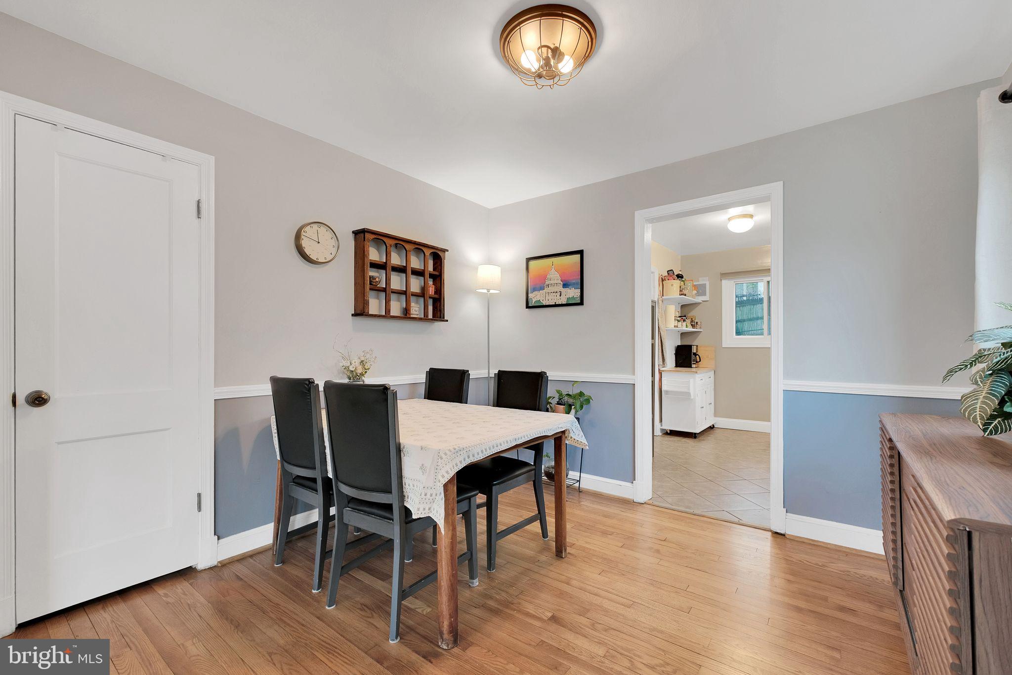 2204 Prichard Road Silver Spring, MD 20902 - Photo 6 of 26 a view of a dining room with furniture and wooden floor