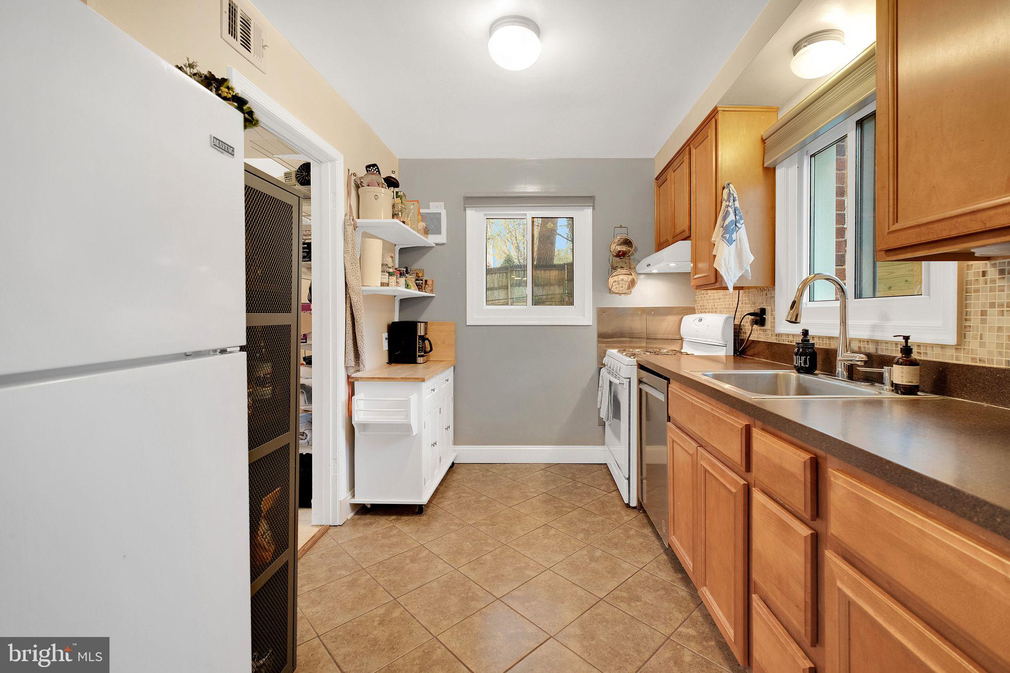 2204 Prichard Road Silver Spring, MD 20902 - Photo 8 of 26 a kitchen with a refrigerator and a sink