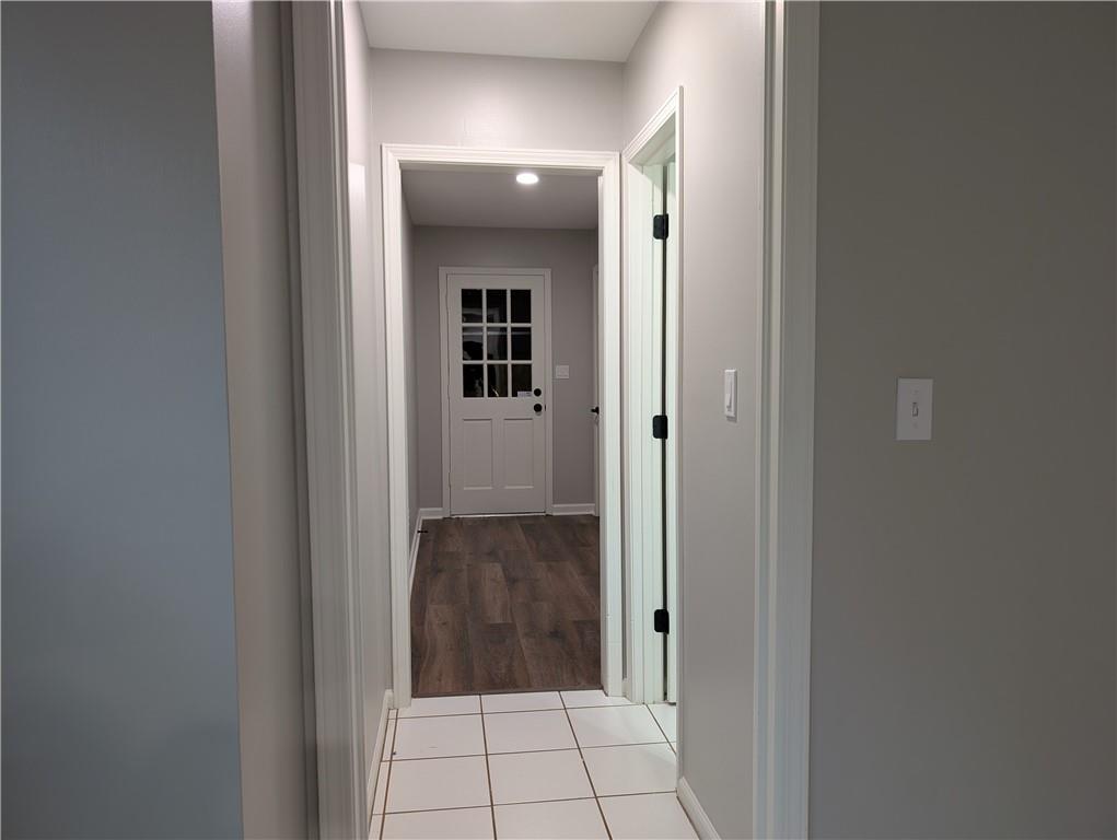 402 Pheasant Run Rome, GA 30161 - Photo 64 of 74 a view of a hallway with wooden floor and staircase
