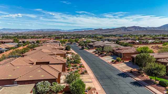 322 340 E Street Ivins, UT 84738 - Photo 60 of 61 Residential neighborhood featuring a paved street, terracotta-tiled roofs, and surrounding mountainous terrain