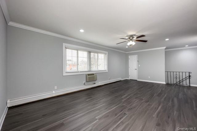 58 Horseblock Road, Unit 582B Centereach, NY 11720 - Photo 5 of 7 a view of an empty room with wooden floor and a window