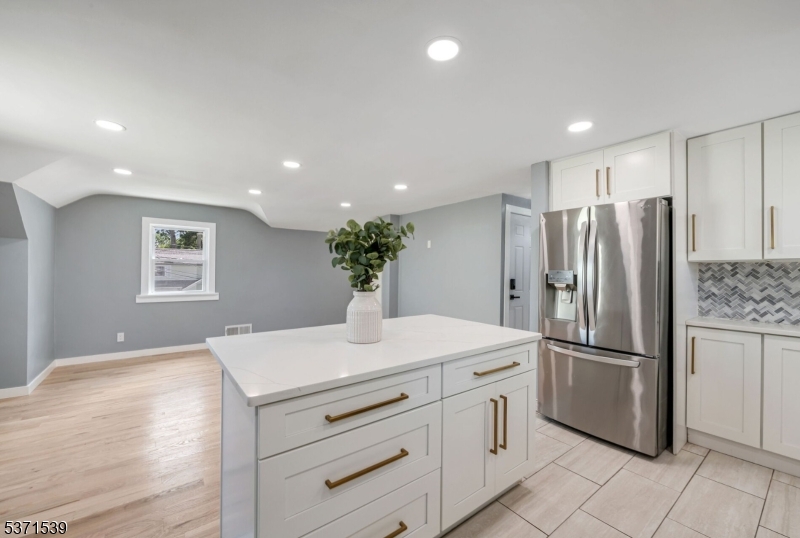 47 Ekings Avenue Hawthorne, NJ 07506 - Photo 6 of 12 a kitchen with stainless steel appliances a refrigerator sink and stove