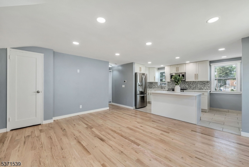 47 Ekings Avenue Hawthorne, NJ 07506 - Photo 7 of 12 a view of kitchen with kitchen island wooden floor center island and stainless steel appliances
