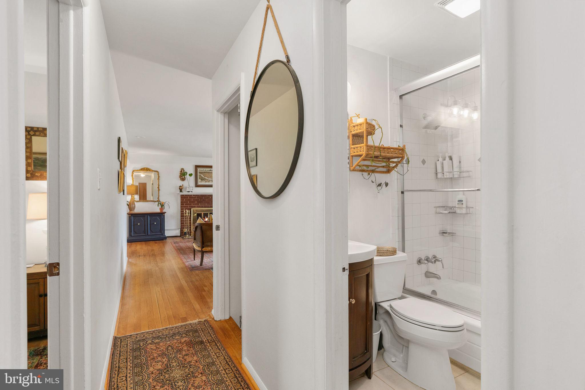 6714 Ruskin Street Springfield, VA 22150 - Photo 30 of 63 a bathroom with a toilet and a mirror