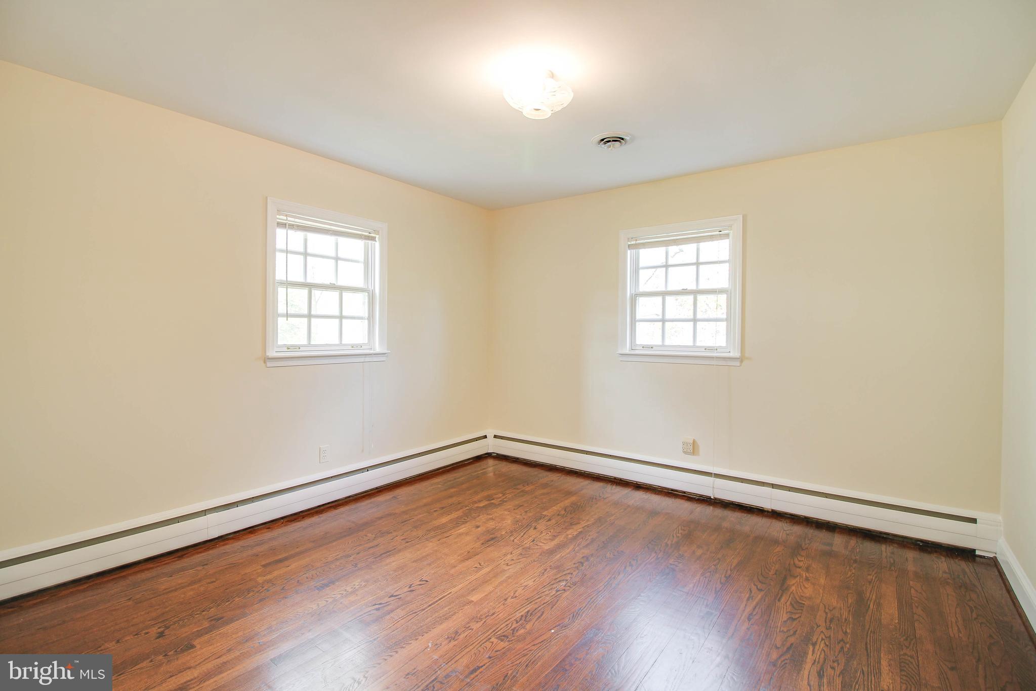 14 Overhill Road Catonsville, MD 21228 - Photo 28 of 38 an empty room with wooden floor and windows
