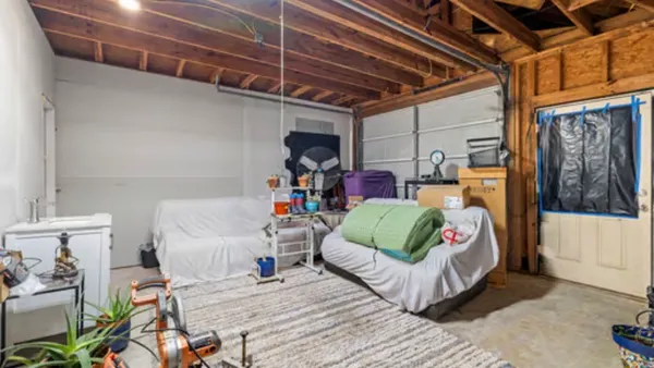 a bed room with a bed and a window