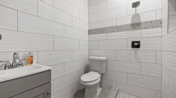 a bathroom with a toilet and sink