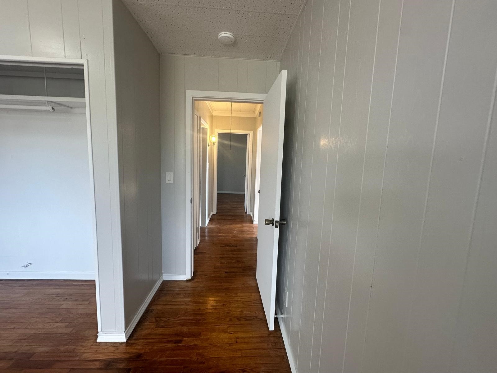 918 West 5th Street, Unit 1 Freeport, TX 77541 - Photo 19 of 21 a view of a hallway with wooden floor