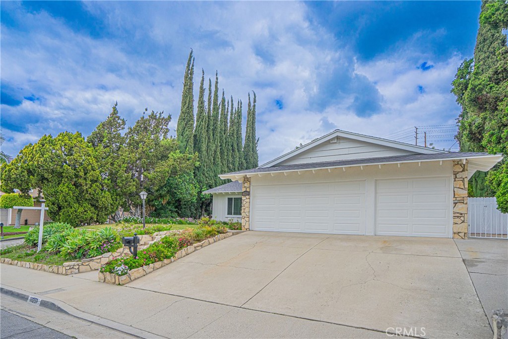 18259 Midbury Street Brea, CA 92821 - Photo 2 of 2 a front view of a house with garden