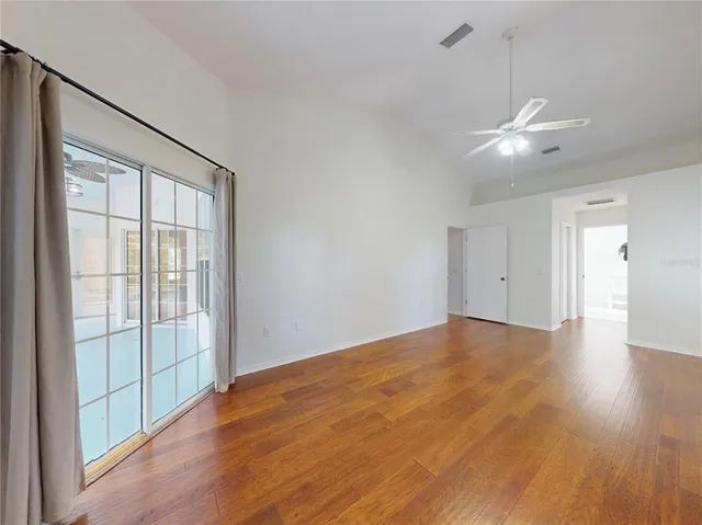 a large kitchen with stainless steel appliances granite countertop a stove refrigerator and a sink