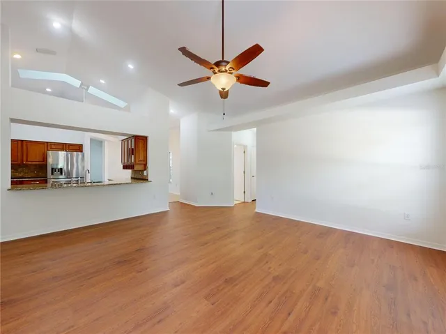 an aerial view of a house with a yard and lake view