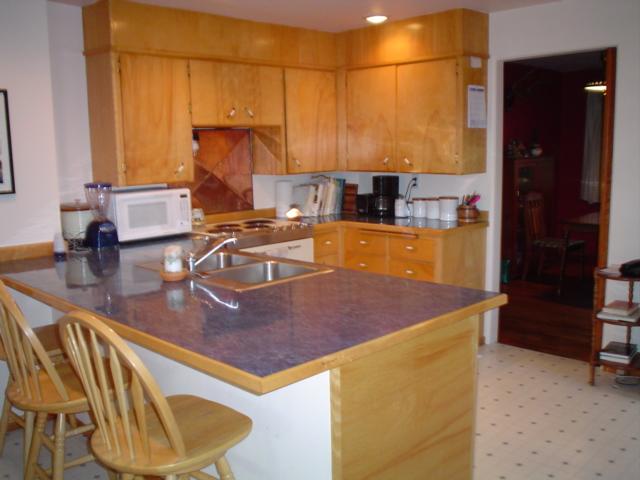 3410 South Stanton Road Yakima, WA 98903 - Photo 3 of 10 a kitchen with a sink a stove and a refrigerator