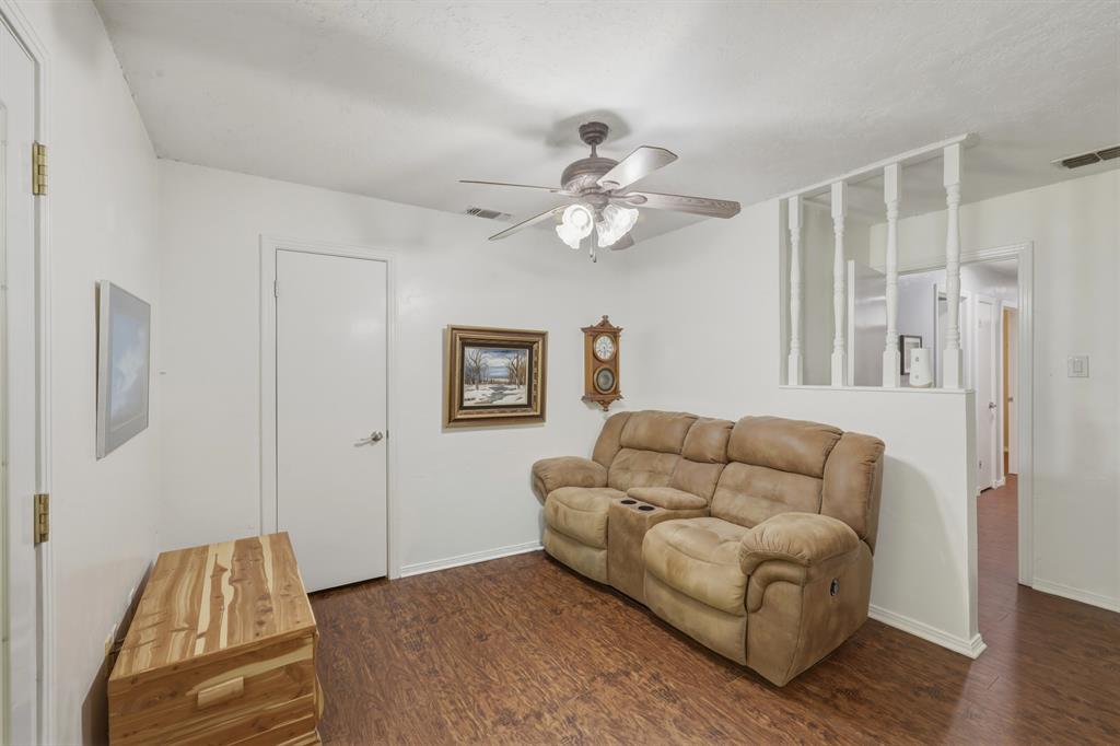 10203 Crestview Drive Tyler, TX 75707 - Photo 11 of 25 a living room with furniture and a ceiling fan