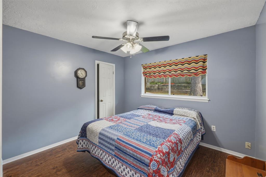 10203 Crestview Drive Tyler, TX 75707 - Photo 13 of 25 a bedroom with a bed and a window