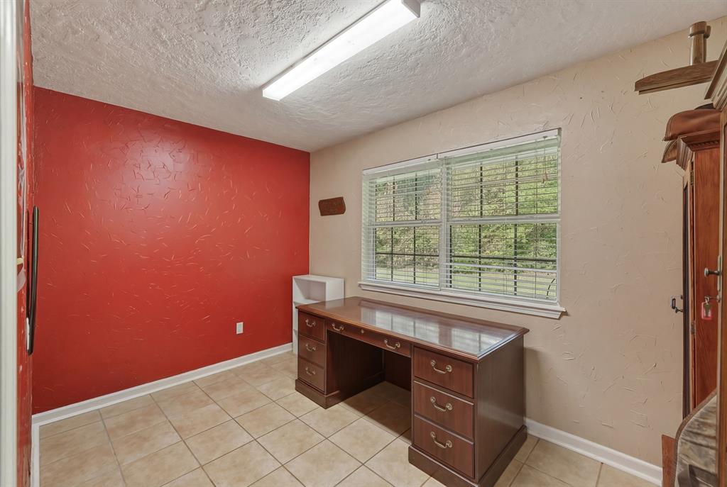 10203 Crestview Drive Tyler, TX 75707 - Photo 18 of 25 a room with a dresser and a window