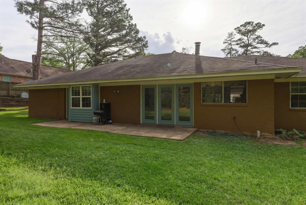 10203 Crestview Drive Tyler, TX 75707 - Photo 19 of 25 front view of a house with a yard