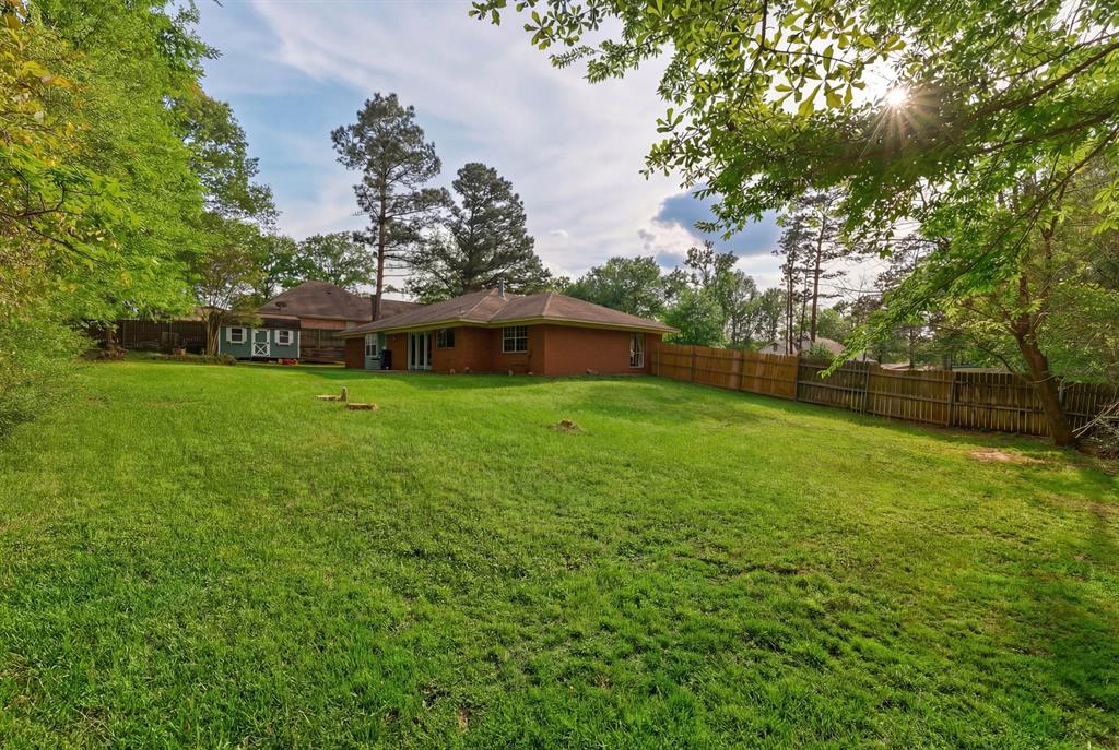 10203 Crestview Drive Tyler, TX 75707 - Photo 22 of 25 a view of a house with a yard