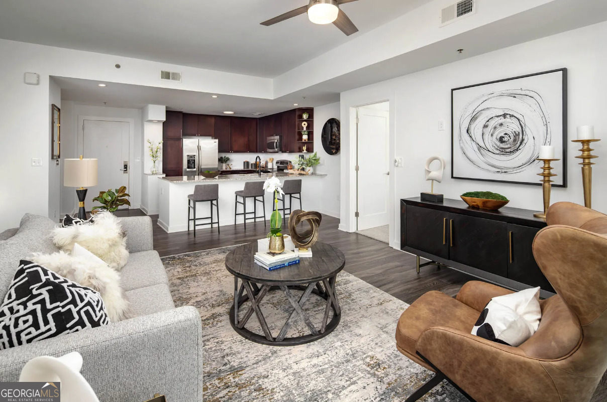 3242 Peachtree Road Northeast, Unit 1408 Atlanta, GA 30305 - Photo 11 of 41 a living room with furniture and kitchen view