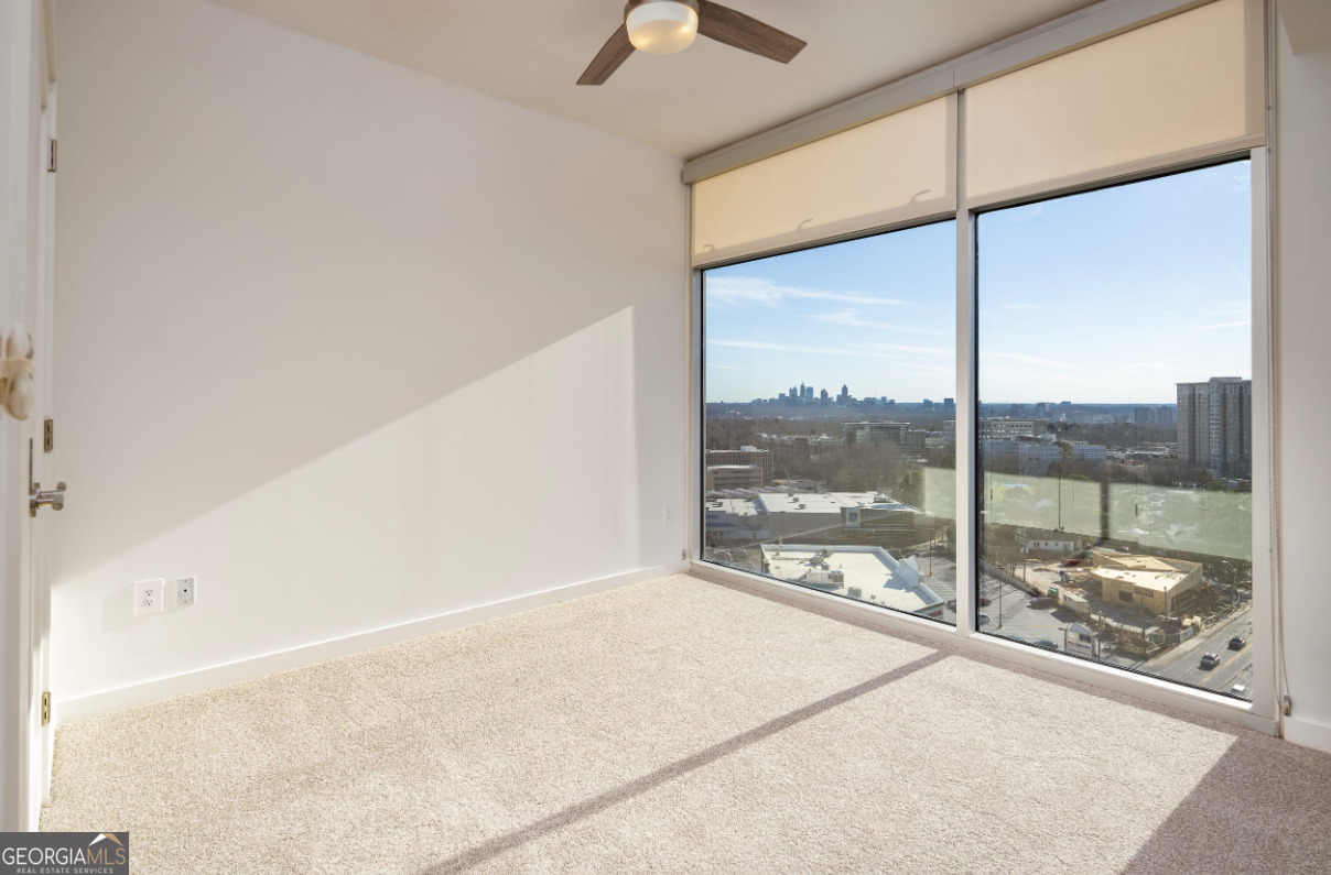 3242 Peachtree Road Northeast, Unit 1408 Atlanta, GA 30305 - Photo 16 of 41 a view of a room with a large window