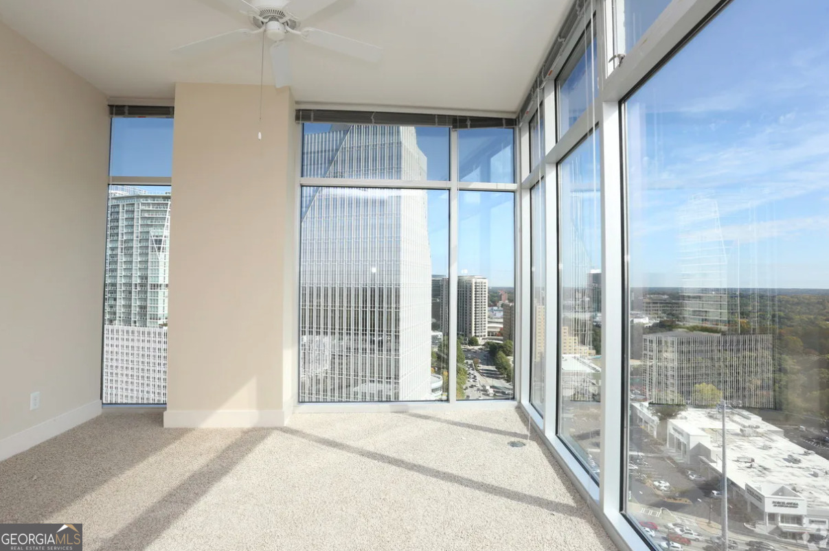 3242 Peachtree Road Northeast, Unit 1408 Atlanta, GA 30305 - Photo 17 of 41 a view of a room with a balcony