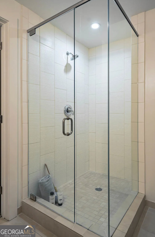3242 Peachtree Road Northeast, Unit 1408 Atlanta, GA 30305 - Photo 19 of 41 a bathroom with a shower and a sink