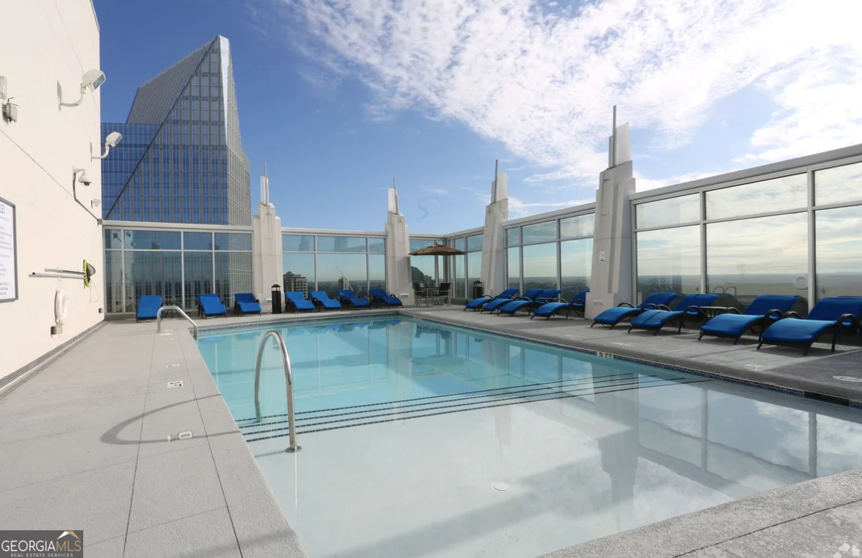 3242 Peachtree Road Northeast, Unit 1408 Atlanta, GA 30305 - Photo 27 of 41 a view of a kitchen with swimming pool and sitting area