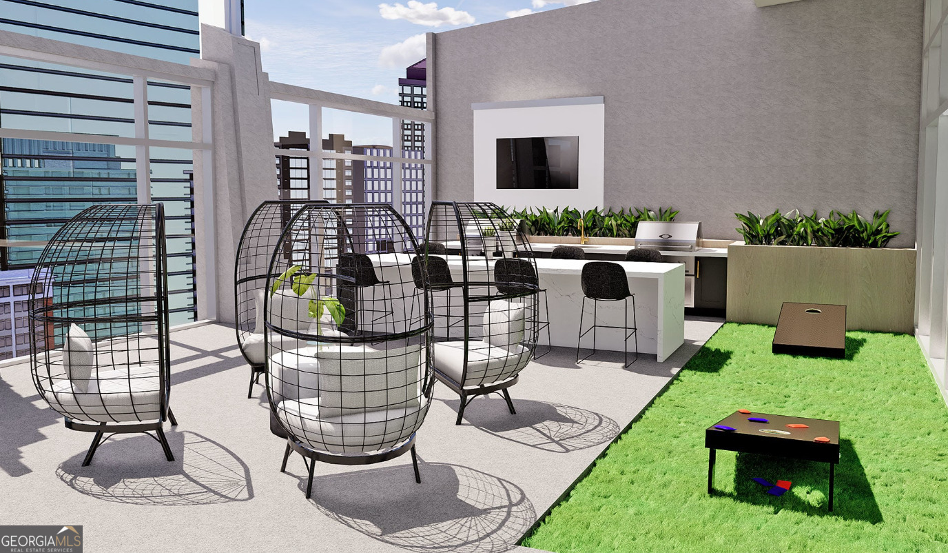 3242 Peachtree Road Northeast, Unit 1408 Atlanta, GA 30305 - Photo 39 of 41 a living room with furniture a flat screen tv and a floor to ceiling window