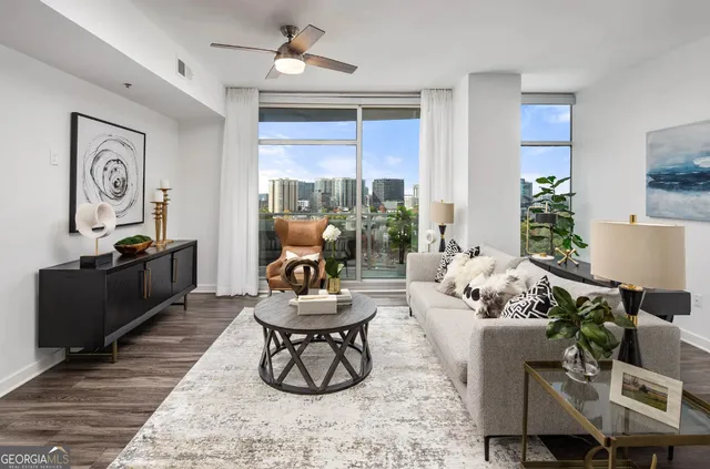 a living room with furniture and a large window