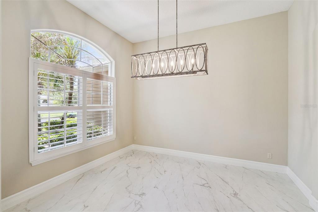 2230 Ridgewind Way Windermere, FL 34786 - Photo 6 of 38 an empty room with windows and outdoor view