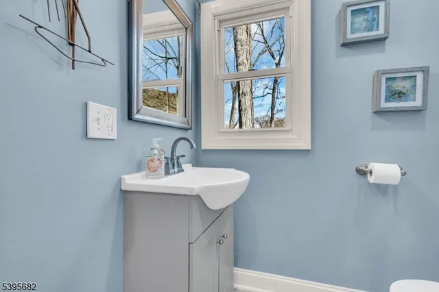 a view of a house with backyard and a tree