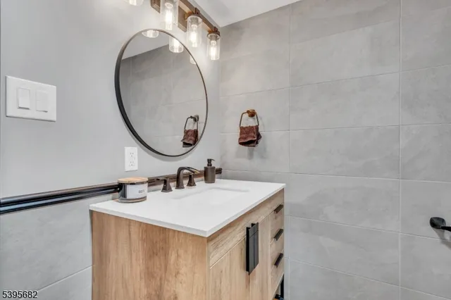 an outdoor sitting area with furniture and wooden deck