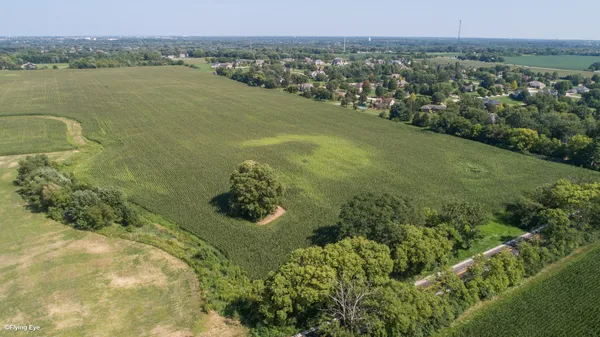 a view of a lake with a yard
