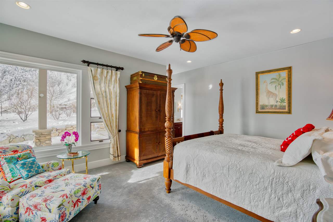 122 Ridgeview Drive Swall Meadows, CA 93514 - Photo 18 of 32 a bedroom with a bed and a chandelier