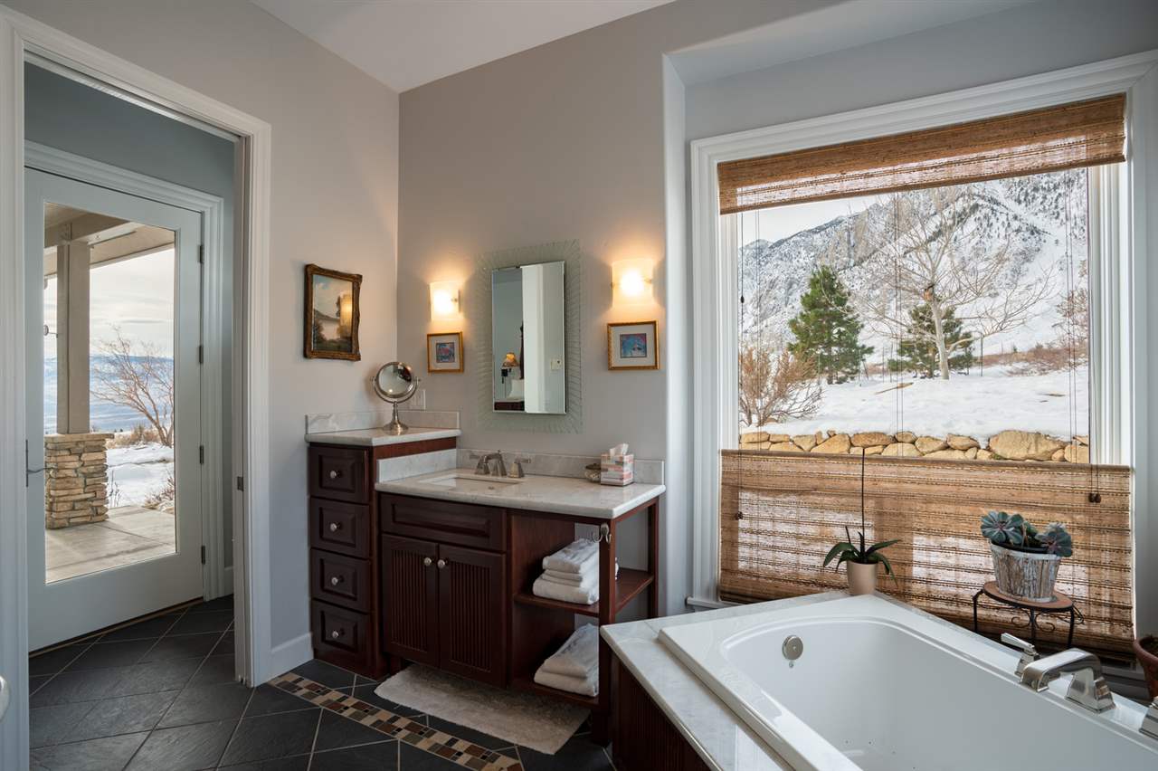 122 Ridgeview Drive Swall Meadows, CA 93514 - Photo 21 of 32 a view of a bathroom with a sink mirror and a window