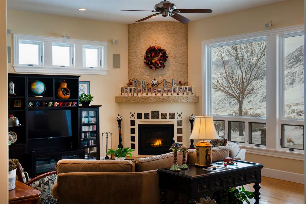 122 Ridgeview Drive Swall Meadows, CA 93514 - Photo 8 of 32 a living room with furniture a fireplace and a flat screen tv